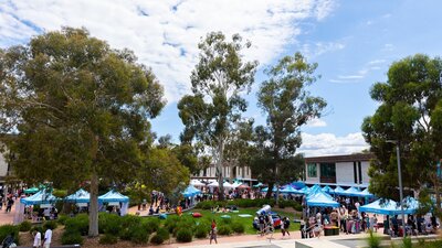 Marquees and people on the UC concourse