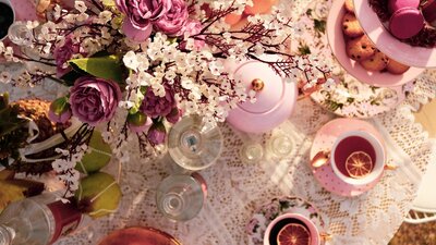 The setting captures the essence of a refined garden party, where every detail is beautiful