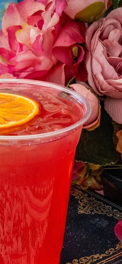 Colourful spring gin cocktail with orange garnish at the Underground Spirits Gin Garden, Floriade Ca
