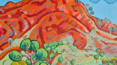 Val JohnsonTrack into Simpsons Gap (detail) a bright orange hill with a blue sky and a green tree in the forground