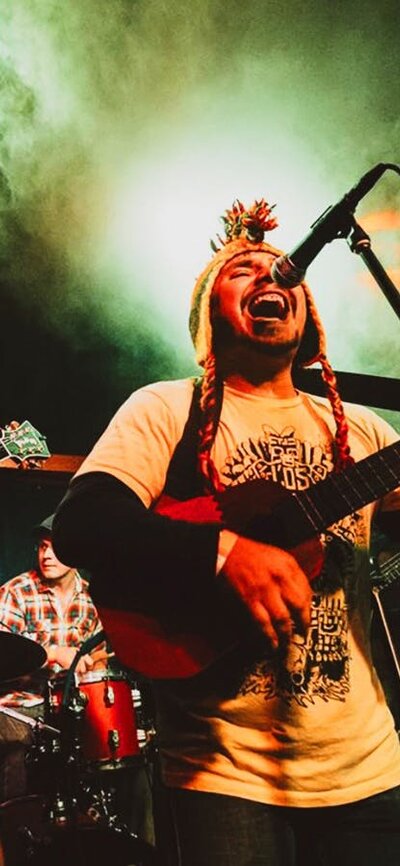 Los Chavos Still of a band performing with singer at front