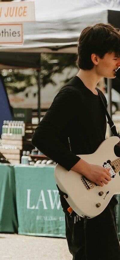 Young musician performing at the markets