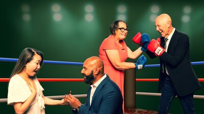 Wedding Ring, suffeRing Two male and female couples . 1 man proposing to a woman. the other couple wearing boxing gloves