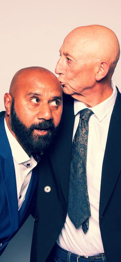 Wedding Ring, suffeRing 2 women and 2 men playing. Women looking shocked as men are kissing each other