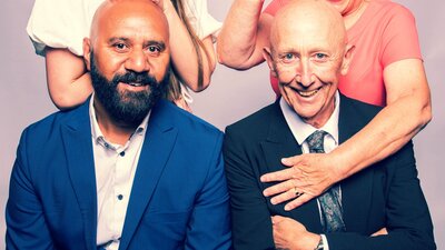 Wedding Ring, suffeRing Two men sitting and theor wives standing behind them making silly faces