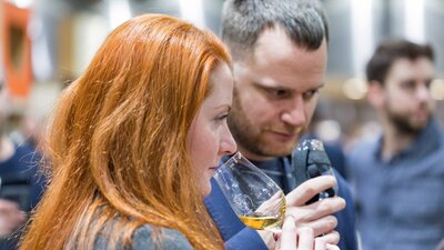 Two people drinking whisky