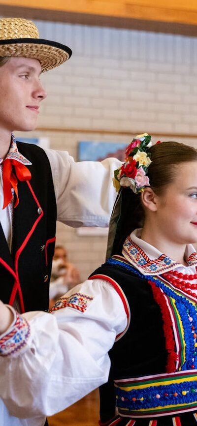 Two people dancing in traditional dress
