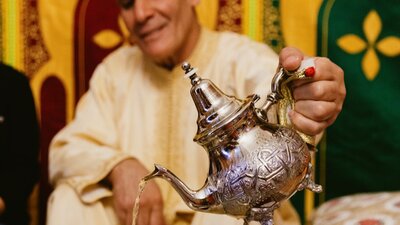 Man pouring tea