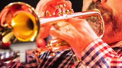 Trumpet player playing world music.