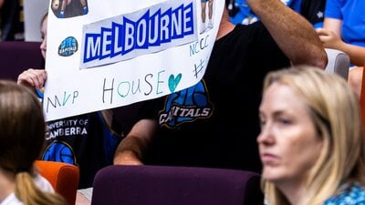 UC Capitals fan holds up sign saying "Jade Melbourne MVP". showing support for the new Uc star......