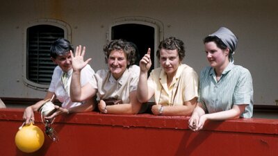 Preparing to embark for Macquarie Island on the MV Thala Dan in 1959 Four women smiling and waving on a boat.