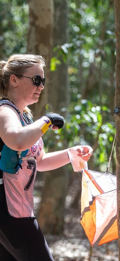 The Women Only Adventure Race is a navigation-based beginner-friendly adventure race a participant 'registering' at the checkpoint at the Women Only Adventure Race