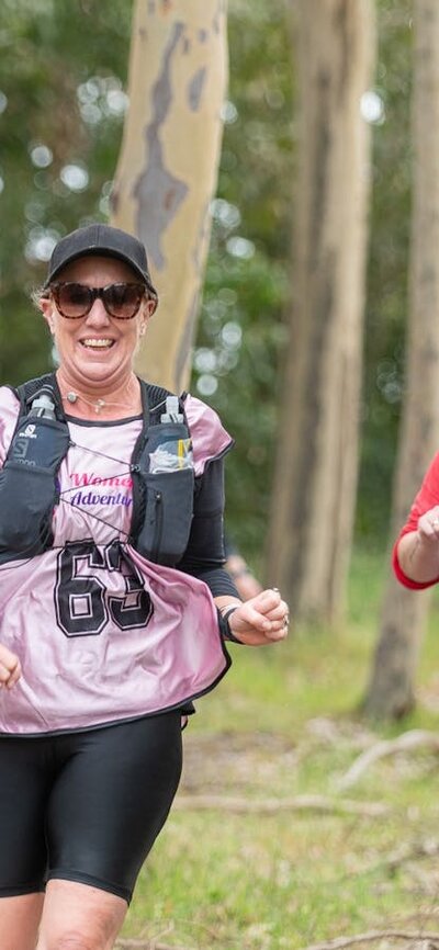 A team is having a great time at the Women Only Adventure Race a team is running at the Women Only Adventure Race