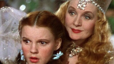 The Wizard of Oz (1939( Young girl stares scared with a fairy leaning behind her