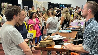 Your Local Wedding Guide Canberra Expo Couples talking with exhibitors at Your Local Wedding Guide Canberra Expo.