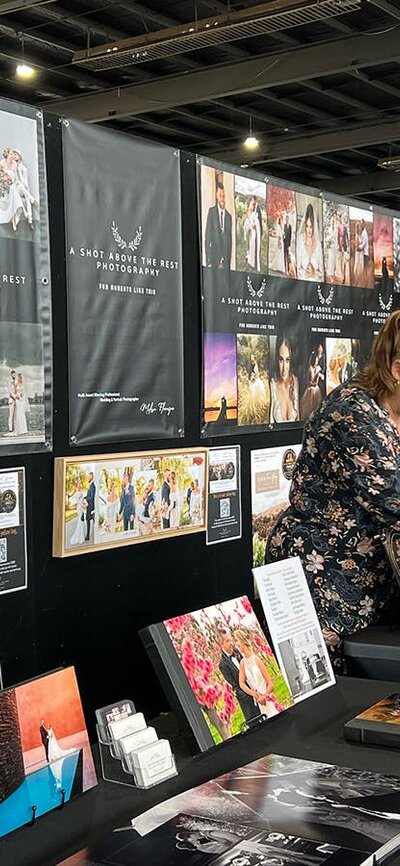 Attendee chatting with Exhibitor at Your Local Wedding Guide Expo.
