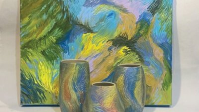 Three ceramic vessels in front of a painting all with the same abstract paint textures